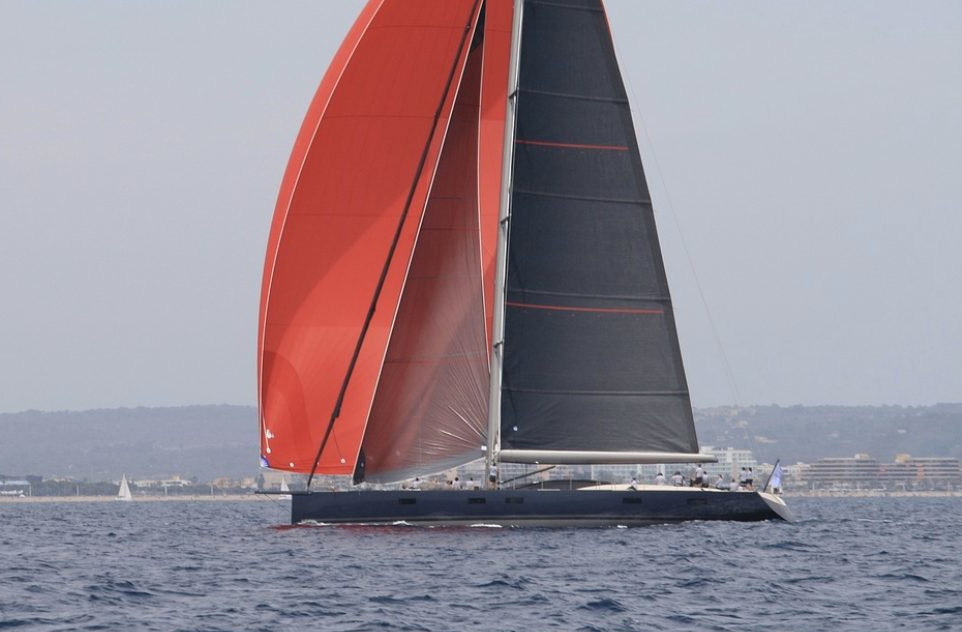 Super yacht flying black Lion Sailing sails